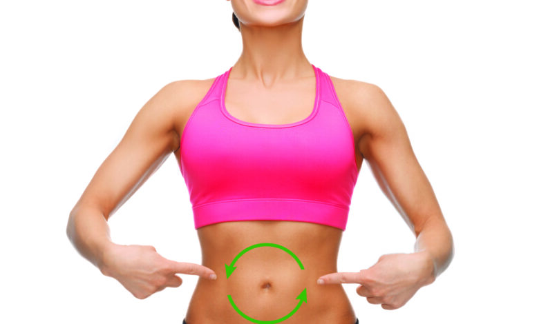 woman pointing at stomach